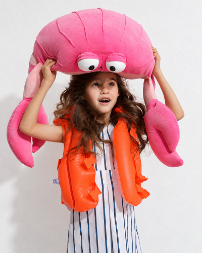 Girl with Giant Pink Plush Crab 2.png